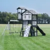 outdoor playset with slide, swings, and climbing wall