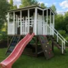 Wooden playhouse with slide and climbing wall